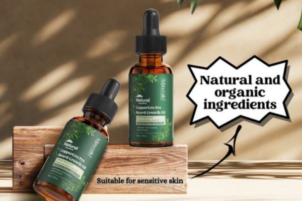 Two bottles of Mayraki CopperGro Pro Beard Growth Oil displayed on wooden blocks, with text reading “Natural and organic ingredients” and “Suitable for sensitive skin,” highlighting the oil’s gentle, eco-conscious formula for daily beard care.
