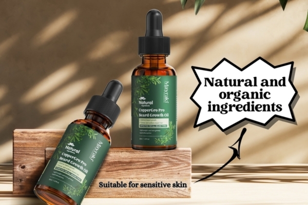 Two bottles of Mayraki CopperGro Pro Beard Growth Oil displayed on wooden blocks with bold text highlighting "Natural and organic ingredients" and "Suitable for sensitive skin," emphasizing a gentle solution to fix a patchy beard.